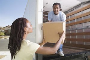 man is shifting container with a woman