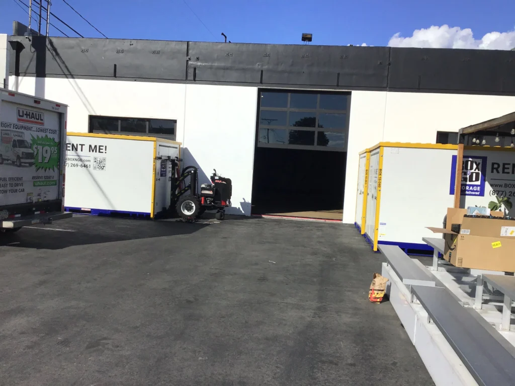 Box-n-Go storage units outside a commercial building in Del Rey, ideal for mobile storage Washington Blvd, student storage LMU, portable storage Playa Vista, and secure storage near Marina Marketplace.