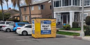 A yellow Box-n-Go storage container placed on a residential street in Pico Robertson, Los Angeles