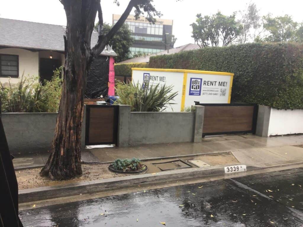 Storage container named Box N Go Rent Me inside the house yard in Sherman Oaks