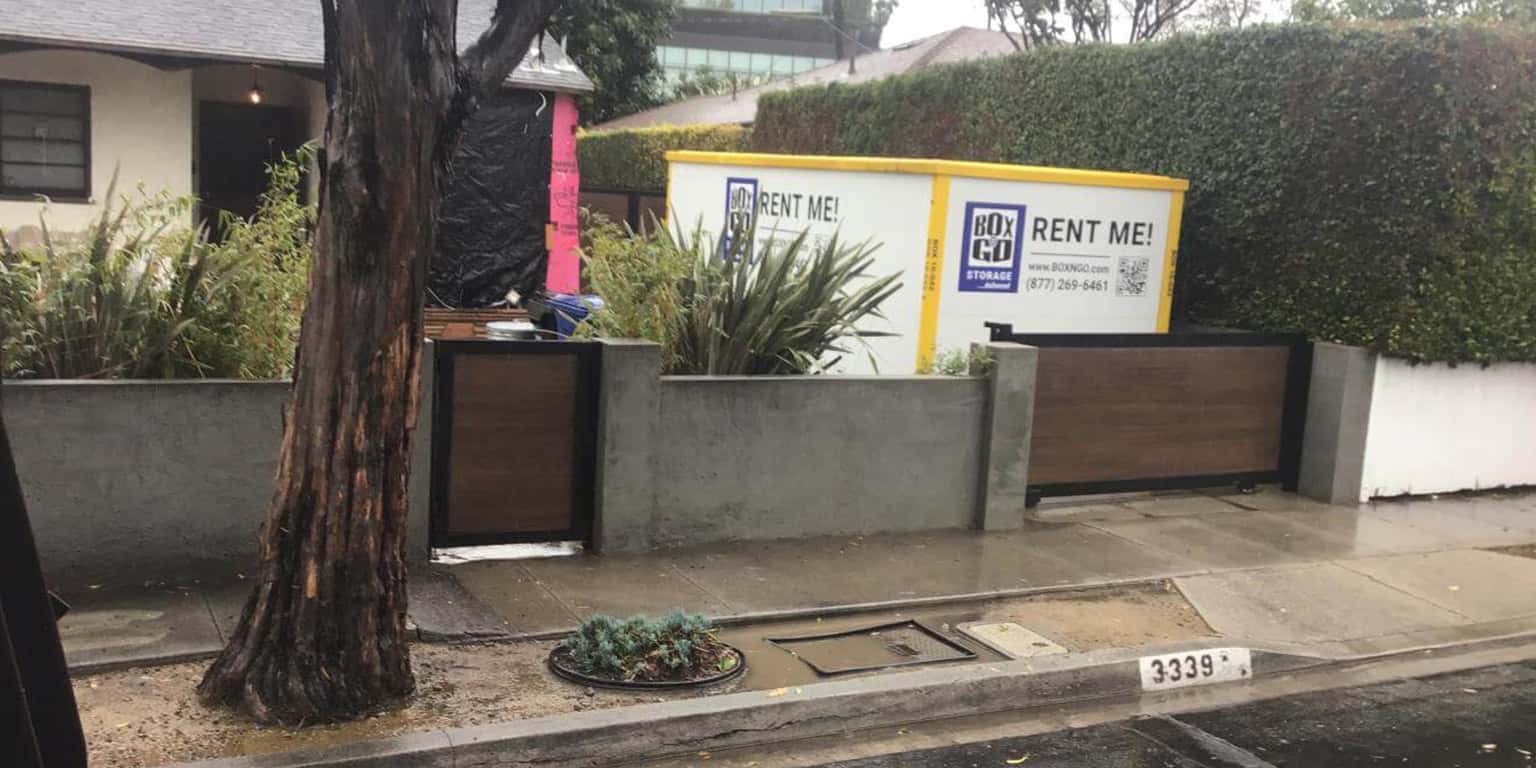 Storage container named Box N Go Rent Me inside the house yard in Sherman Oaks