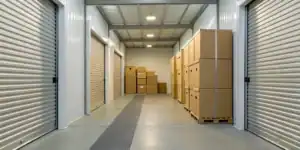Secure small business self storage units with stacked boxes.