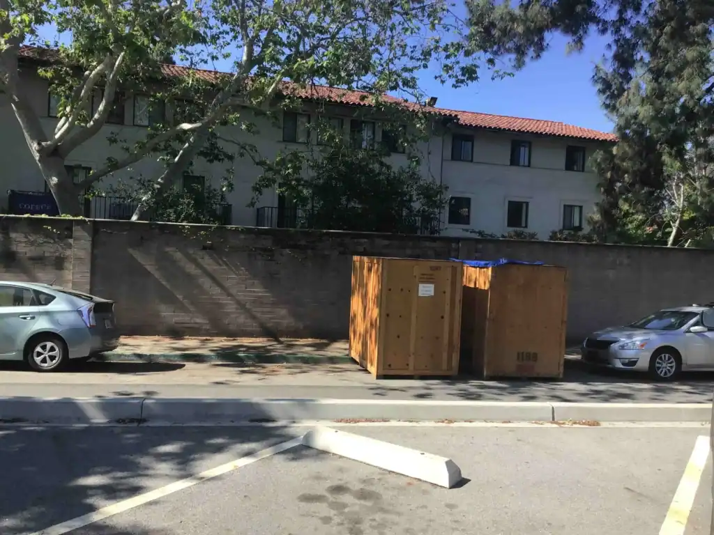 Affordable self storage in Marina del Rey CA with portable wooden storage containers placed outdoors for convenient moving and temporary storage solutions.