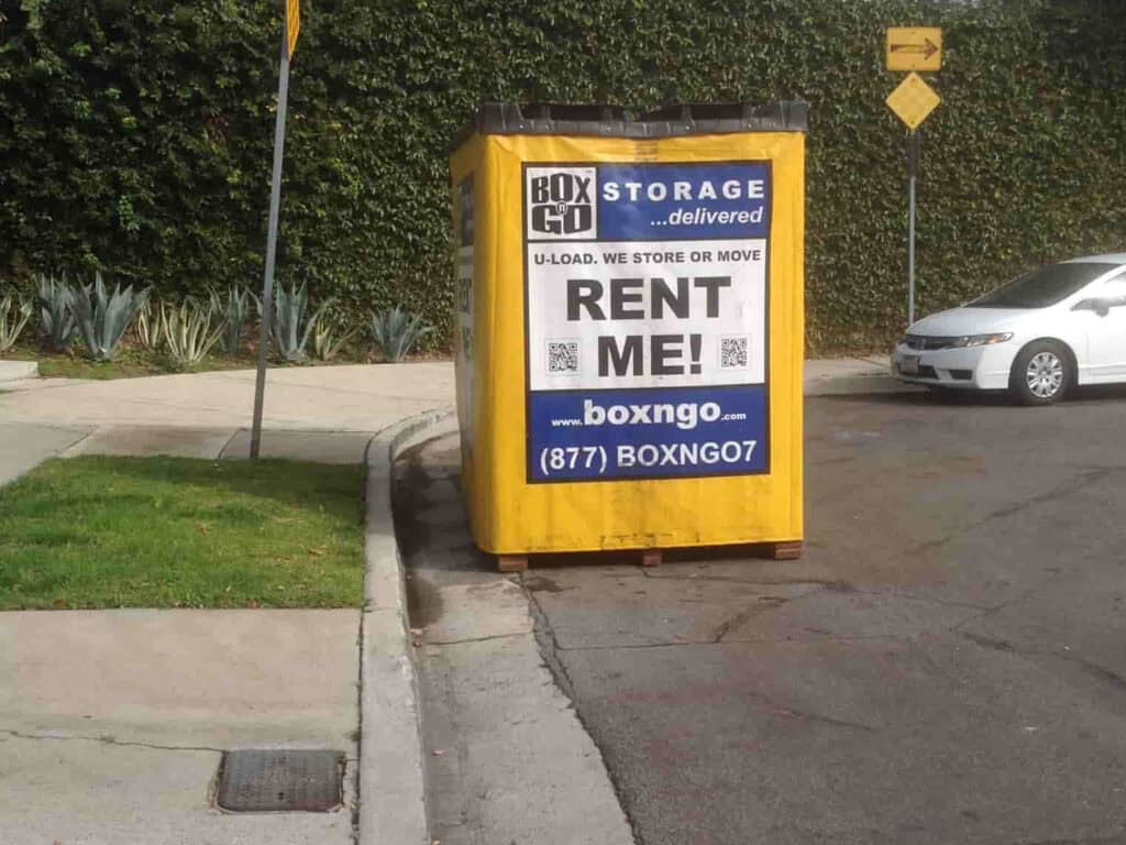 Box-N-Go cheap storage units Santa Monica placed near driveway curb.