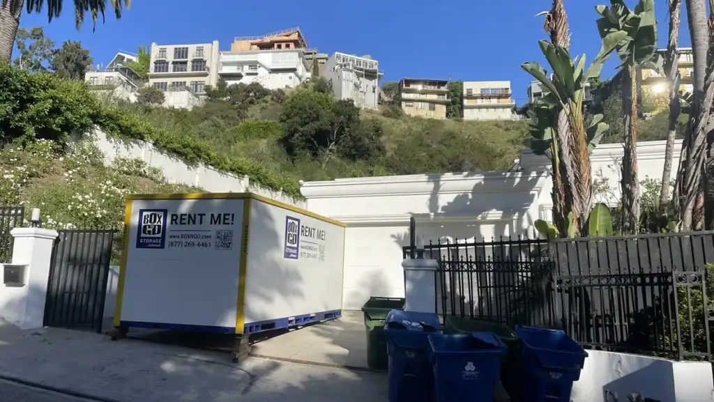 Box-n-Go portable container placed in a residential driveway offering secure and flexible self storage in South Gate CA for homeowners and renters.
