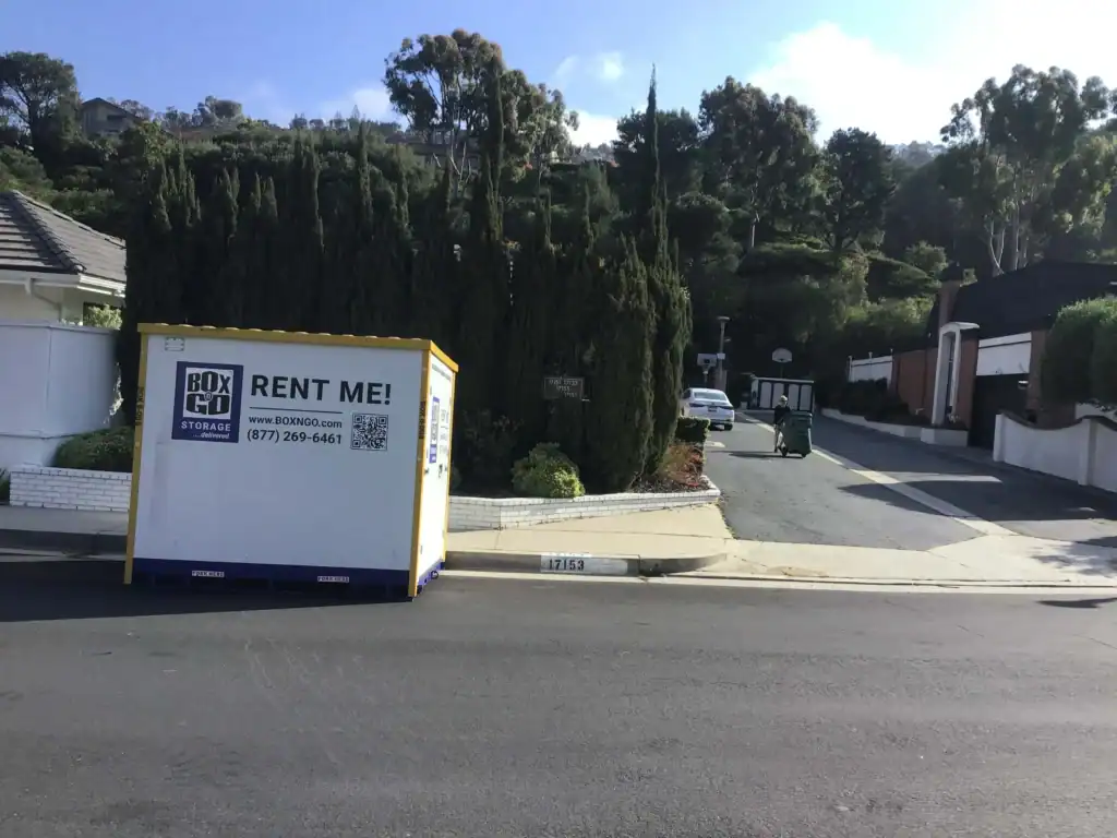 Box-n-Go portable container providing convenient self storage in East Los Angeles CA, placed on a residential street for easy moving and storage access.