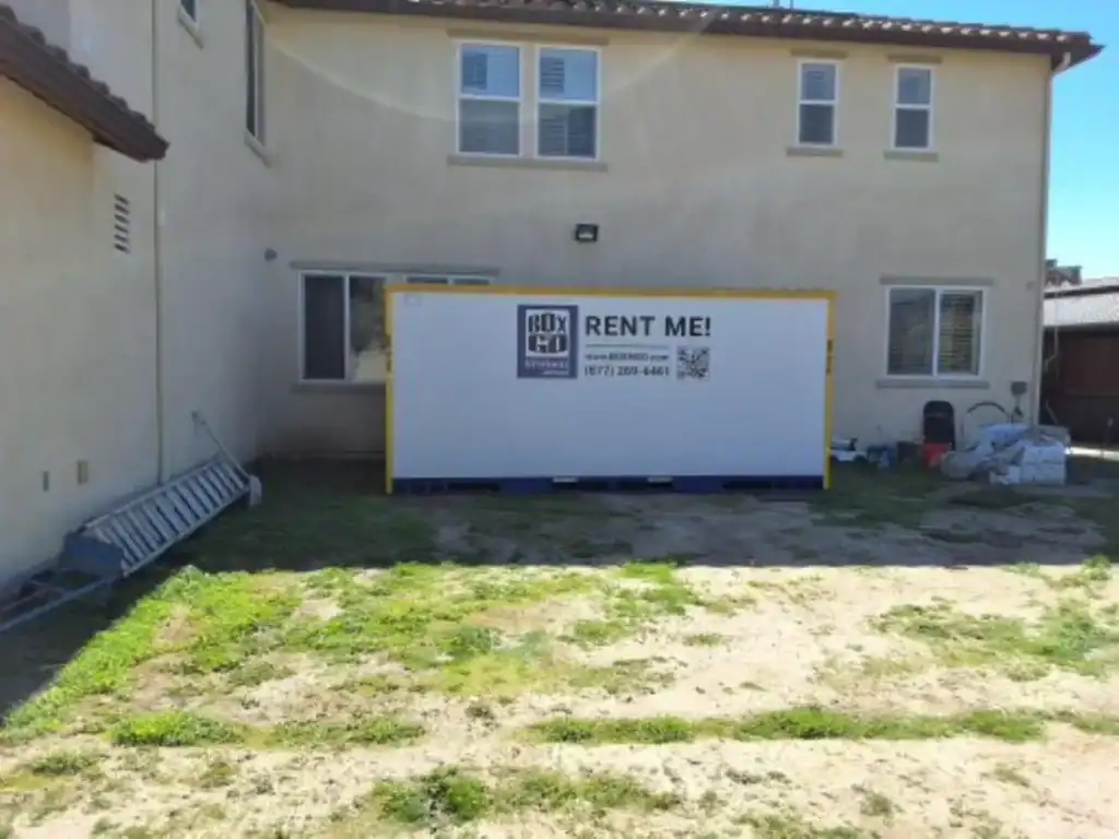 Box-n-Go portable self storage in Beverly Hills CA placed in a residential backyard for secure and convenient storage rental.