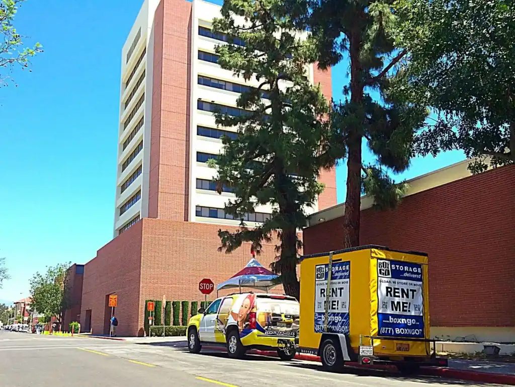 Box-n-Go portable storage container parked outside a student housing building, offering secure and affordable student storage near West Hollywood for college move-outs and summer break storage.