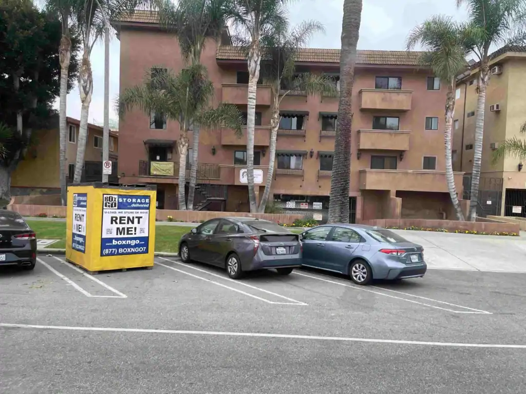 Box-n-Go portable storage container placed in an apartment parking lot, providing convenient and secure Self Storage in Boyle Heights CA