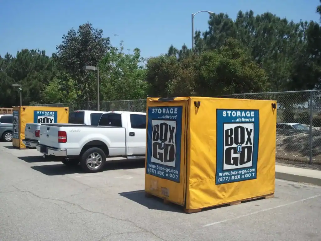 Convenient Self Storage in Whittier CA with portable Box-n-Go storage units placed in a parking lot for easy moving and storage solutions.