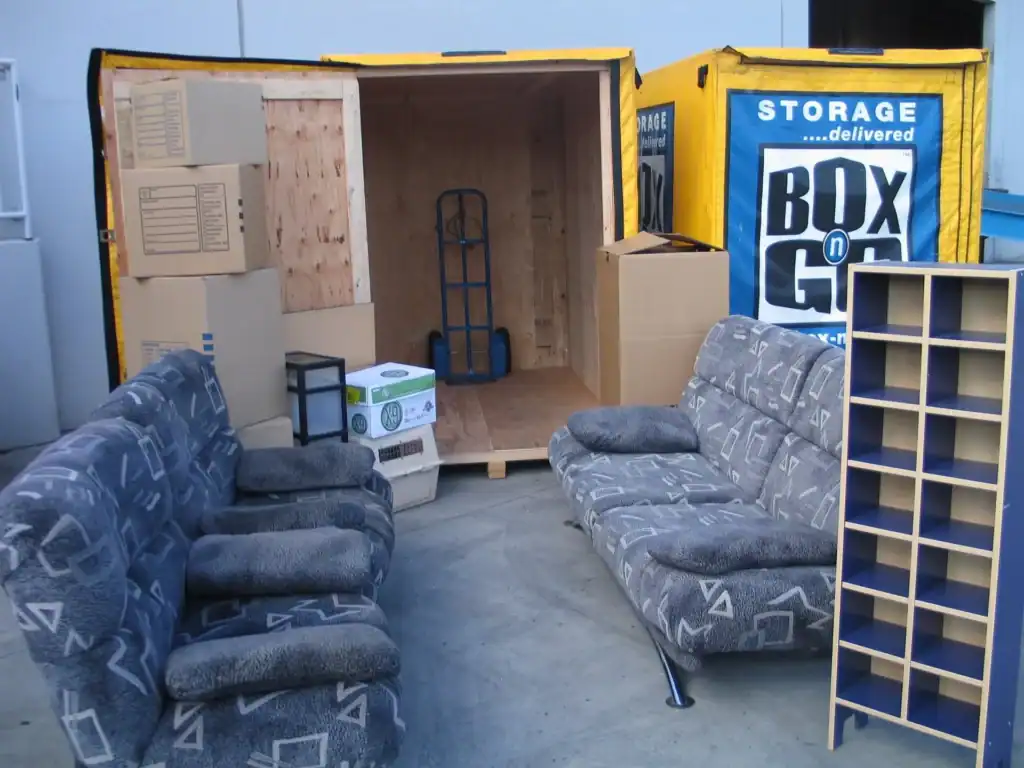 Home renovation storage using a BoxGo portable storage container, filled with boxes, furniture, and other items. The container provides a convenient and secure solution for storing belongings during a home renovation project.