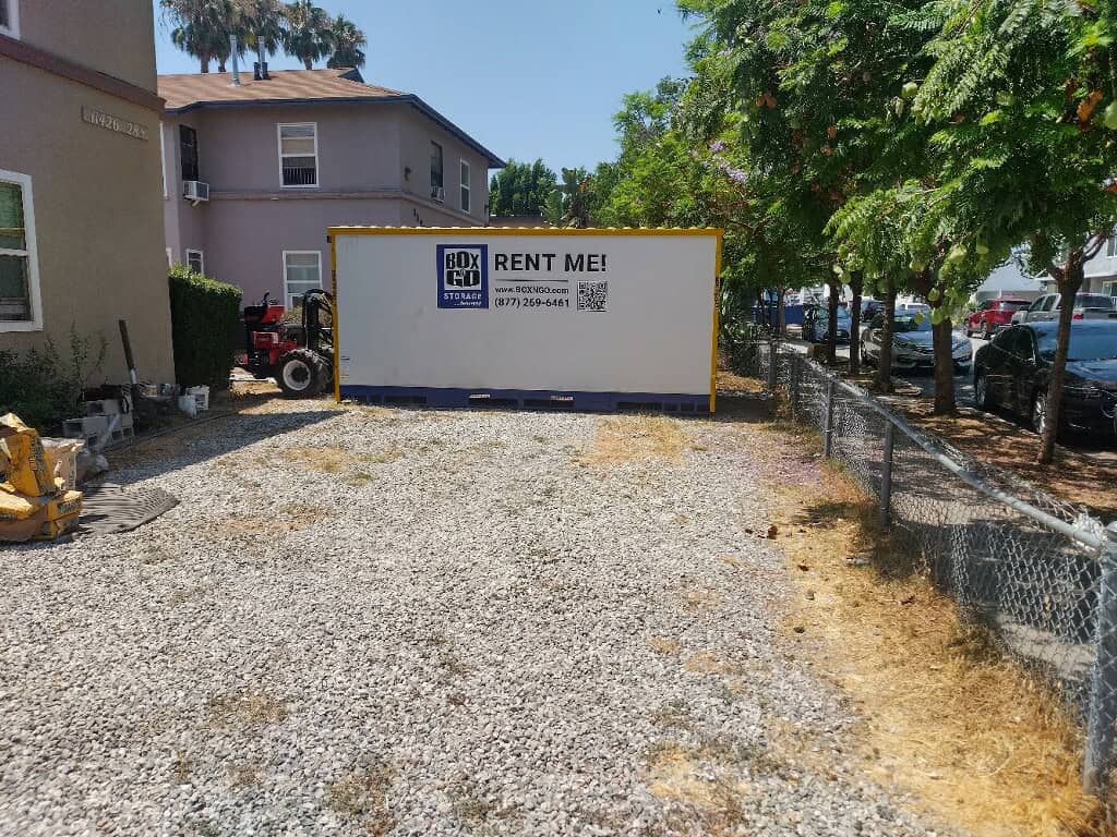 Large Box-n-Go portable unit placed on a gravel driveway, offering secure and convenient self storage in Norwalk CA for residential and business needs.