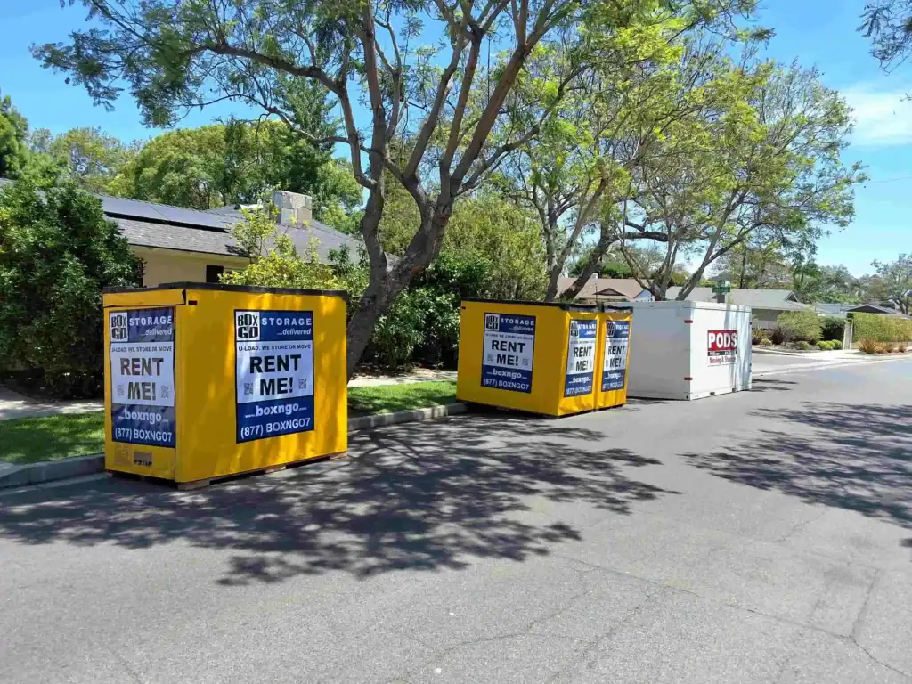 Multiple Box-n-Go portable containers on a residential street offering flexible self storage in East Los Angeles CA for moving and storage needs.