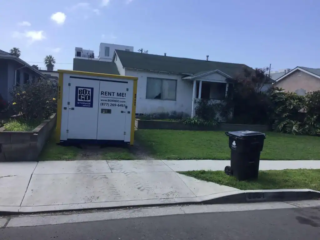 Pacific Palisades storage unit with Box-n-Go portable container placed at a residential home for secure and convenient storage or moving needs.