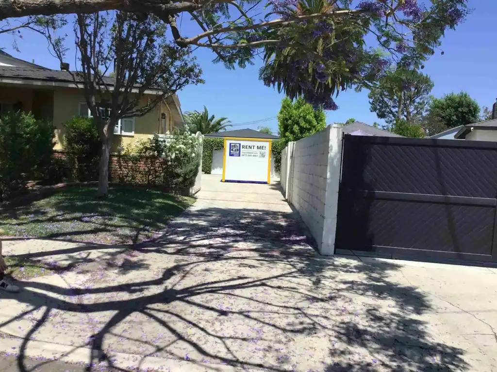 Pacific Palisades storage unit with Box-n-Go portable container placed in a residential driveway for secure and convenient storage solutions.