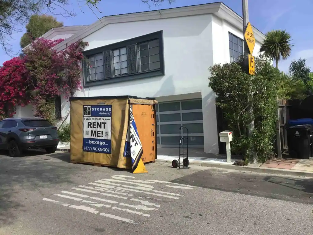 Pacific Palisades storage unit with Box-n-Go portable container placed outside a residential home for secure and convenient moving and storage solutions.