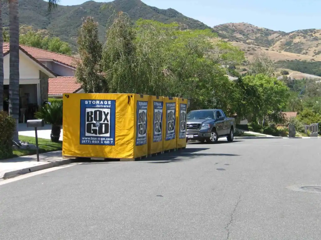 Portable Box-n-Go containers for Self Storage in Whittier CA placed outside a suburban home, offering convenient moving and storage solutions.