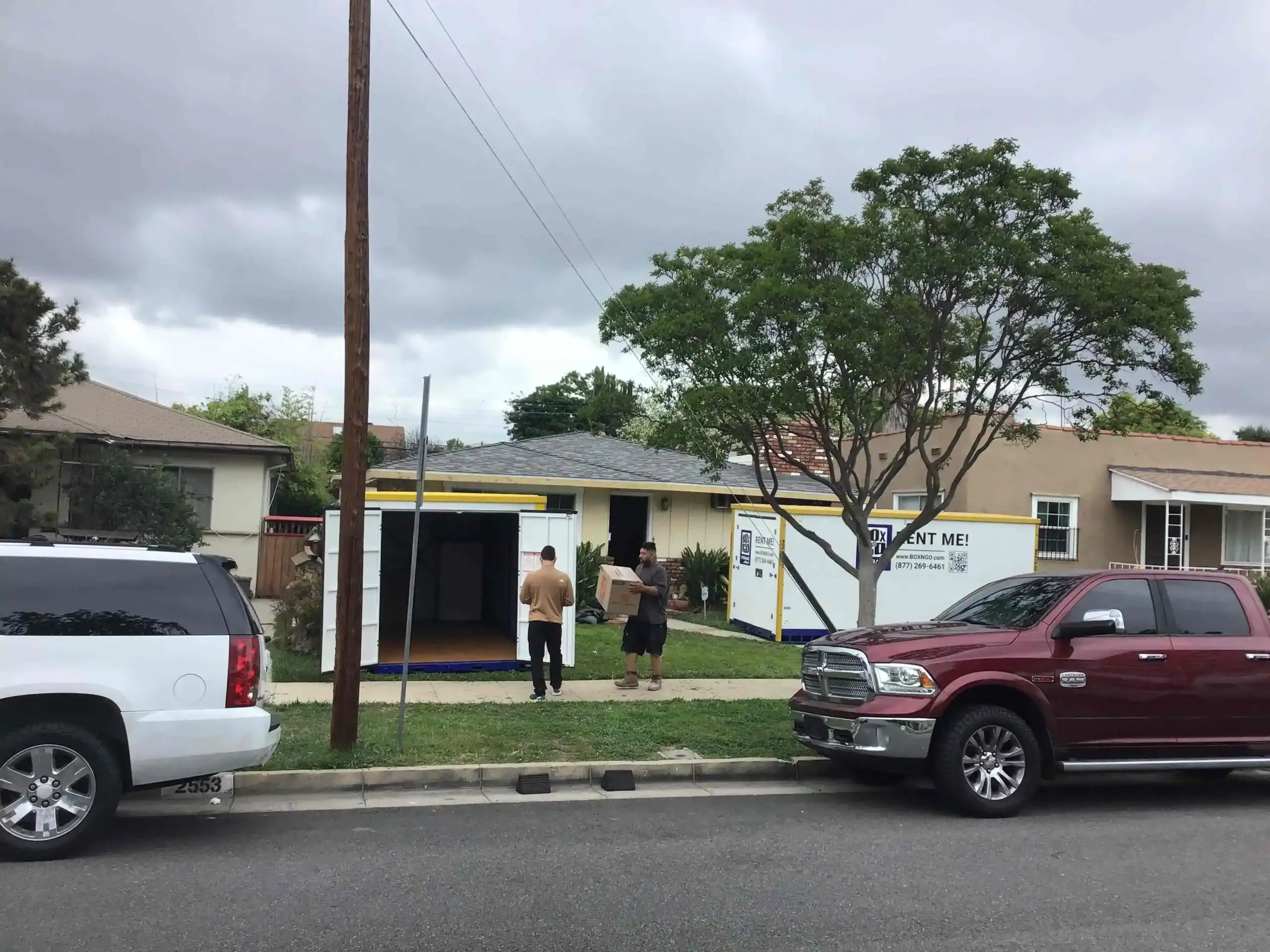 Residents using Box-n-Go portable self storage in Century City CA with containers delivered to the home for easy and secure moving and storage solutions.