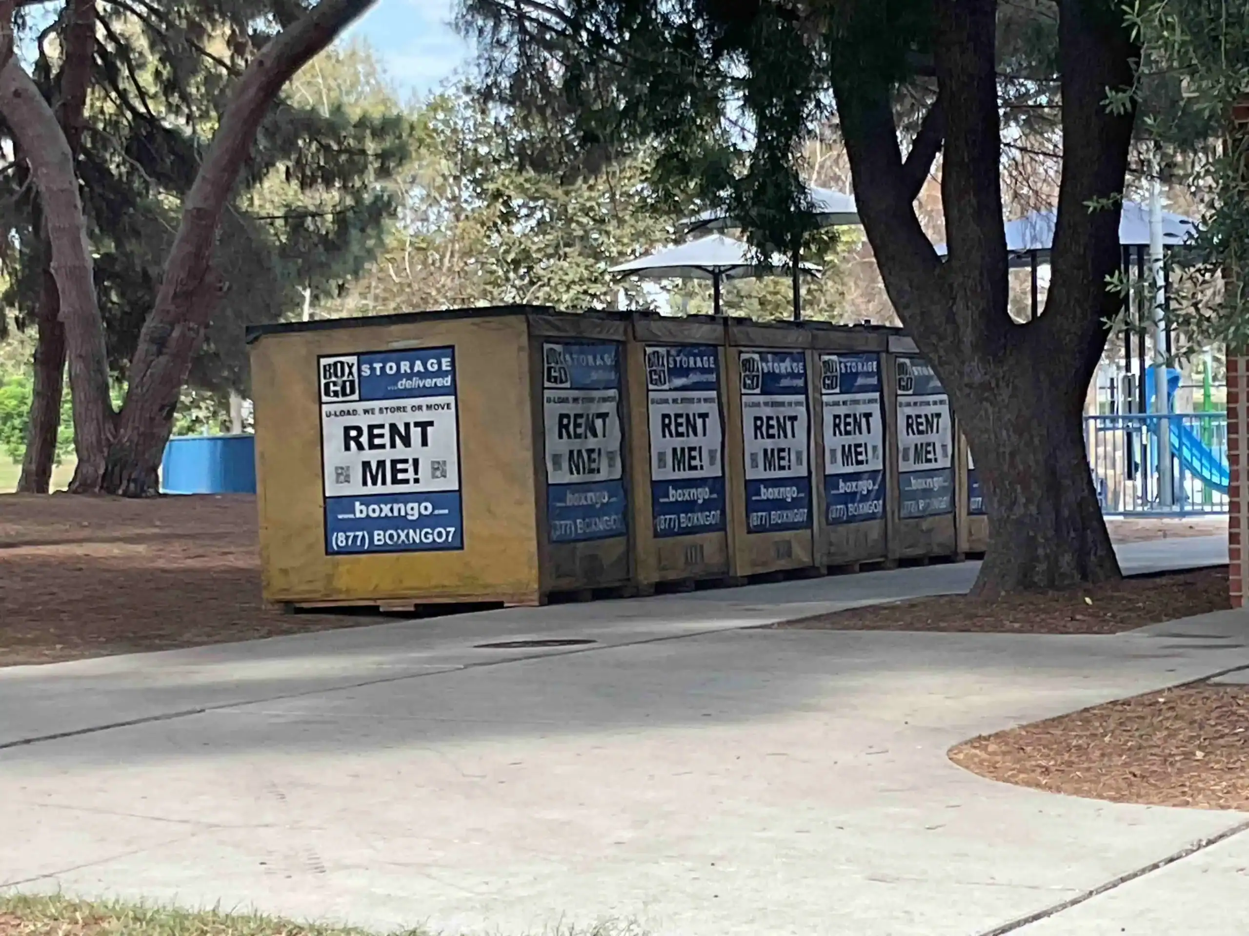 Row of Box-n-Go portable storage containers placed outdoors in Brentwood, offering flexible short term storage Brentwood residents can rent for moving, renovation, or decluttering needs.