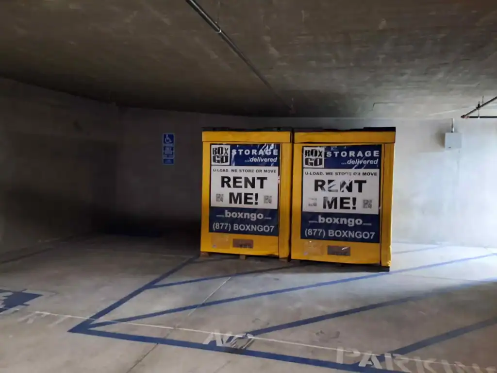 Secure self storage in Malibu CA with Box-n-Go portable storage containers placed in an indoor parking garage for convenient moving and space-saving solutions.