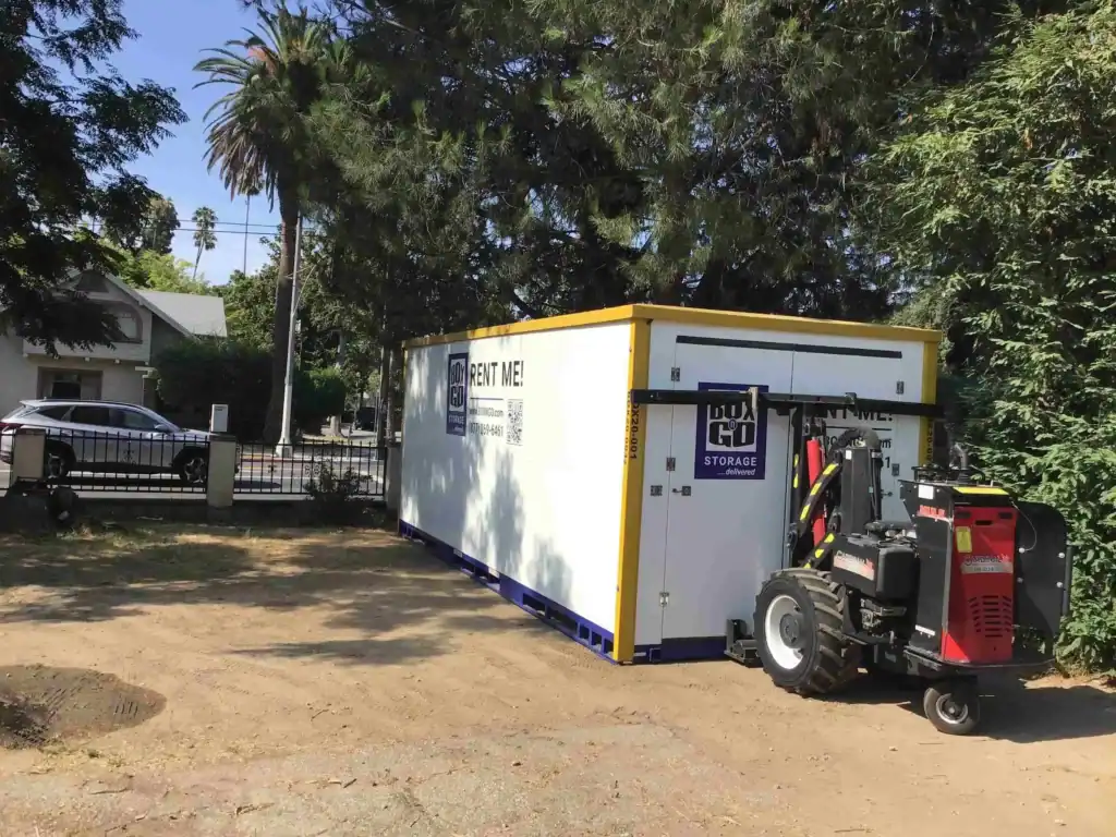 Self storage in Lynwood CA with a portable BOX-n-Go storage container delivered to a residential property, providing convenient and secure storage rental options.
