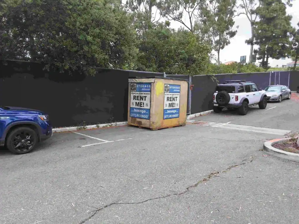 Portable self storage in Huntington Park CA – rental storage container in parking lot for convenient moving and storage solutions.