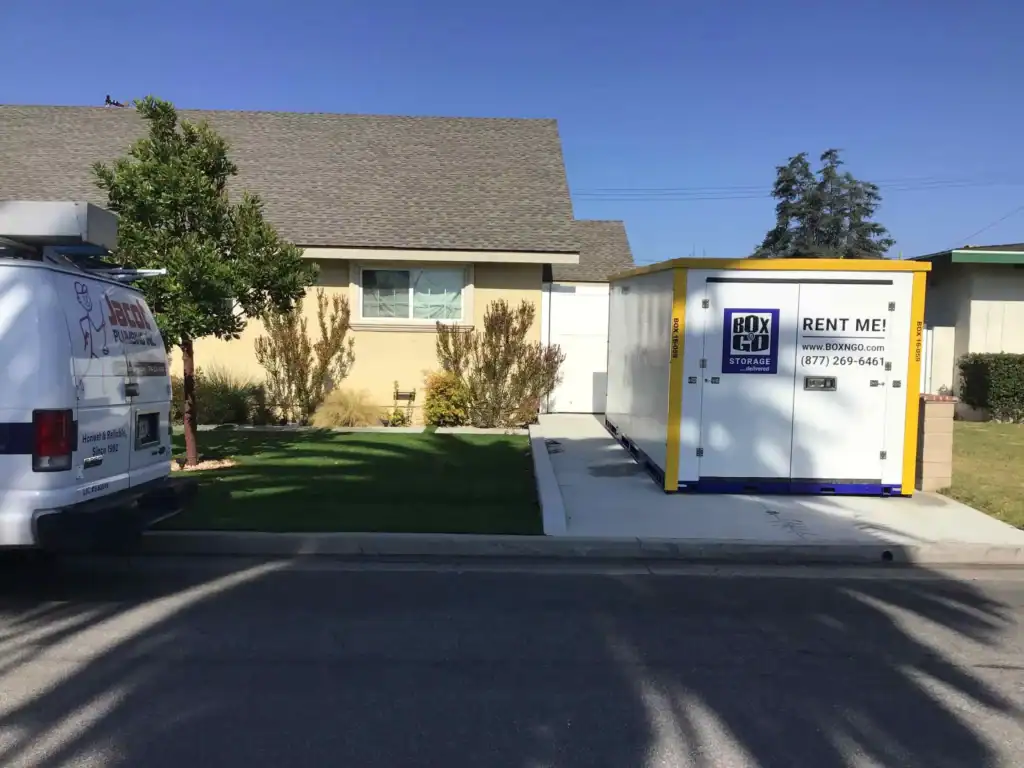 Box-n-Go portable storage container in a residential driveway offering flexible self storage in Maywood CA for homeowners and renters.
