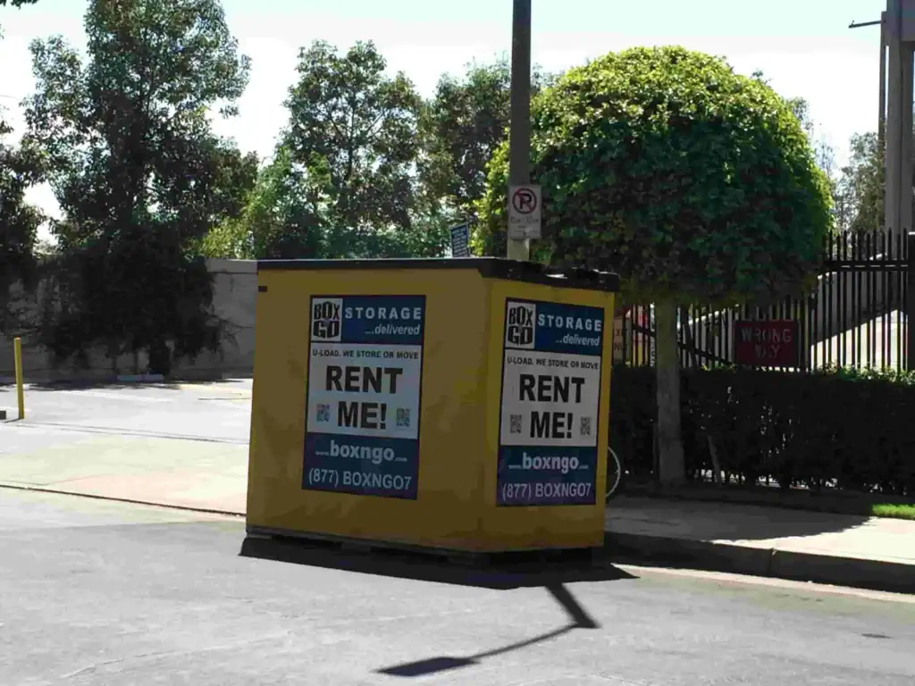 Box-N-Go portable self storage Malibu container placed near sidewalk.
