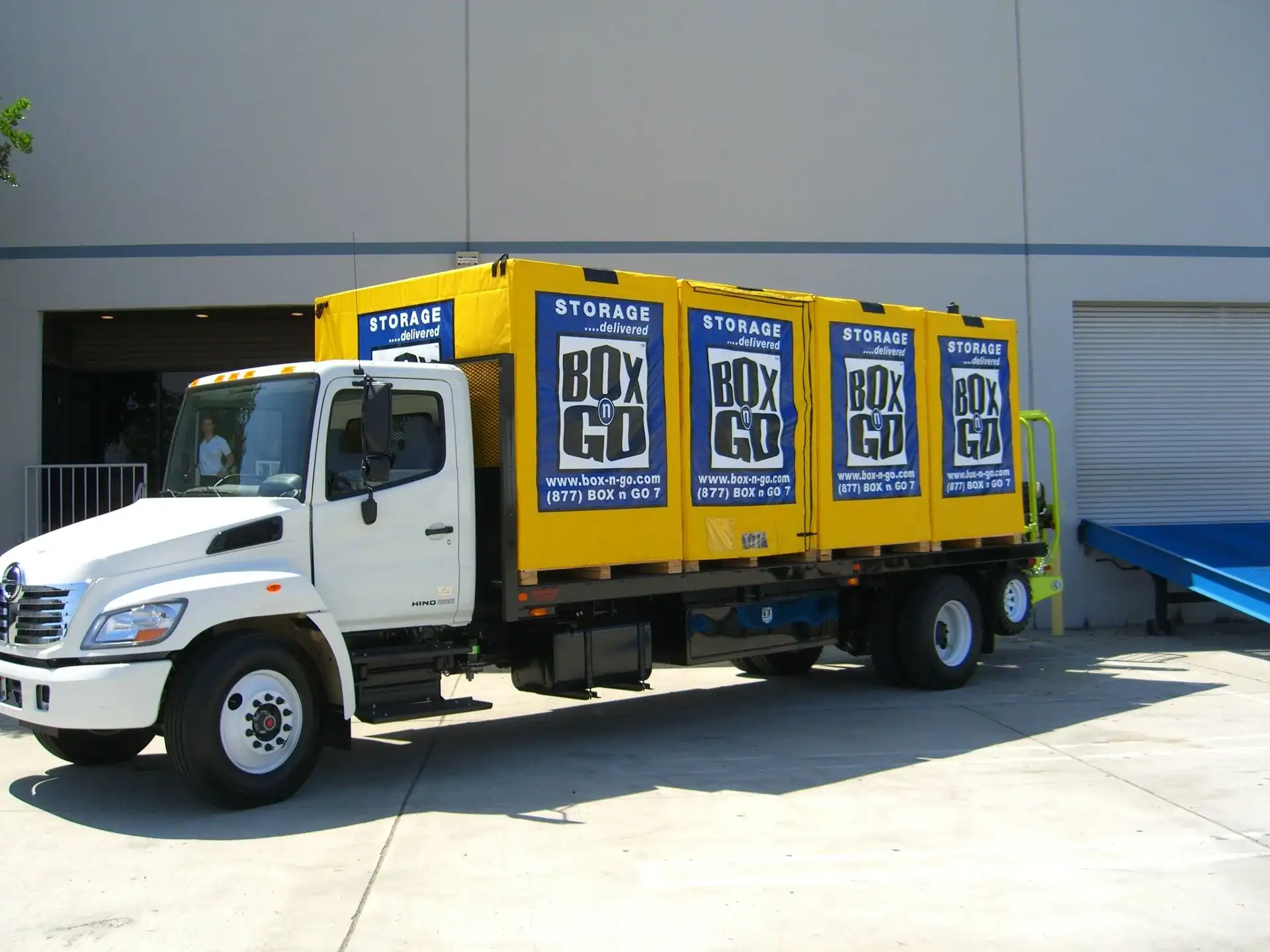 Affordable local moving companies truck with portable storage containers from Box-n-Go, providing convenient and budget-friendly moving and storage solutions.