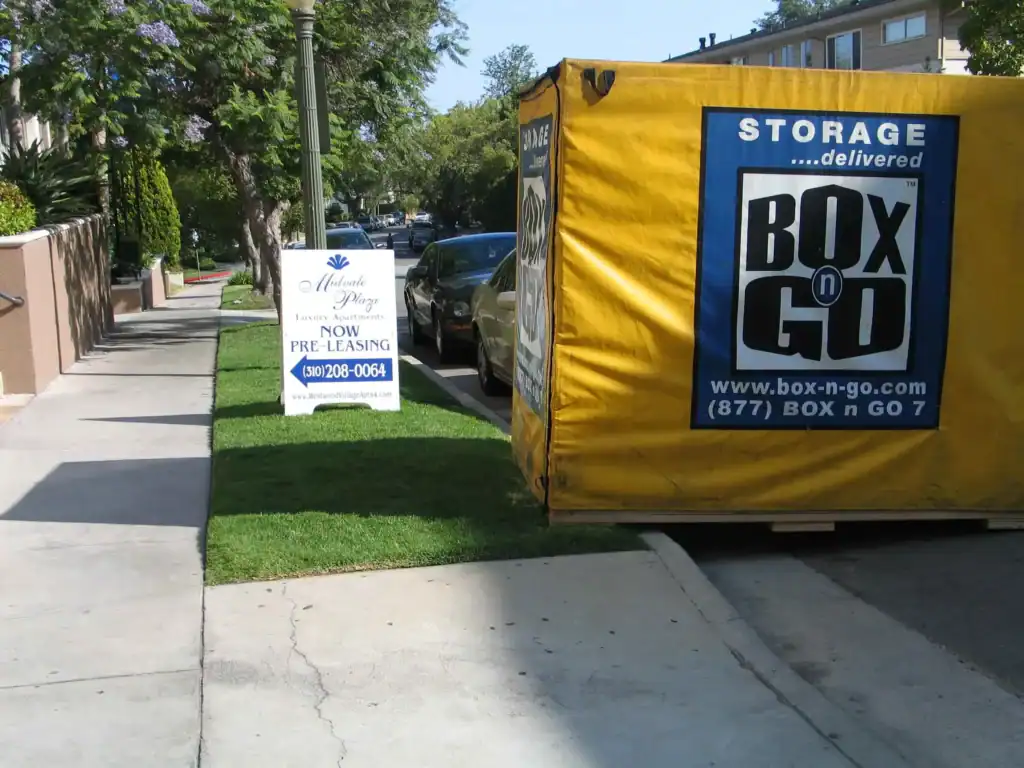 Box-n-Go portable container providing self storage in Culver City CA, placed on a residential street near Midvale Plaza luxury apartments, ideal for convenient and secure local storage solutions.
