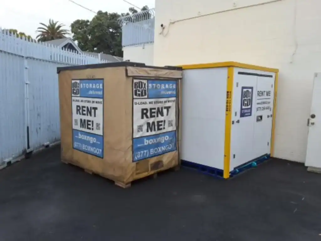Box-n-Go portable containers placed in a secure alleyway, ideal for business storage Venice needs, offering flexible and space-saving commercial storage solutions in urban environments.