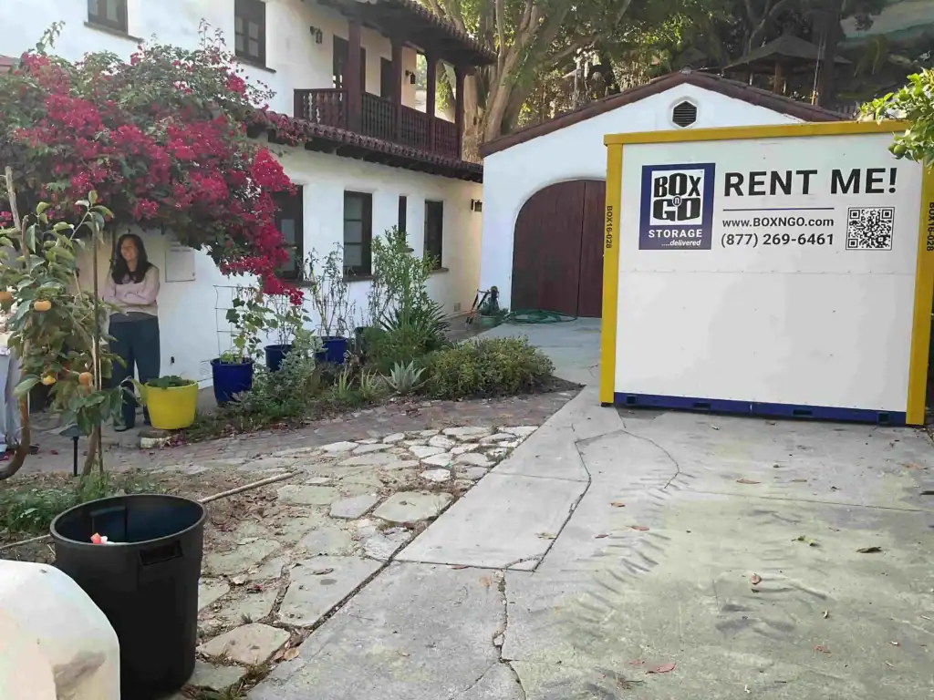 Box-n-Go portable self storage unit placed in a residential driveway in Agoura Hills CA, offering convenient and secure storage solutions for homeowners and renters.