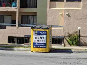 Box-n-Go portable storage container placed outside an apartment building, showing services offered by a local moving company in Sherman Oaks for convenient and flexible relocations.