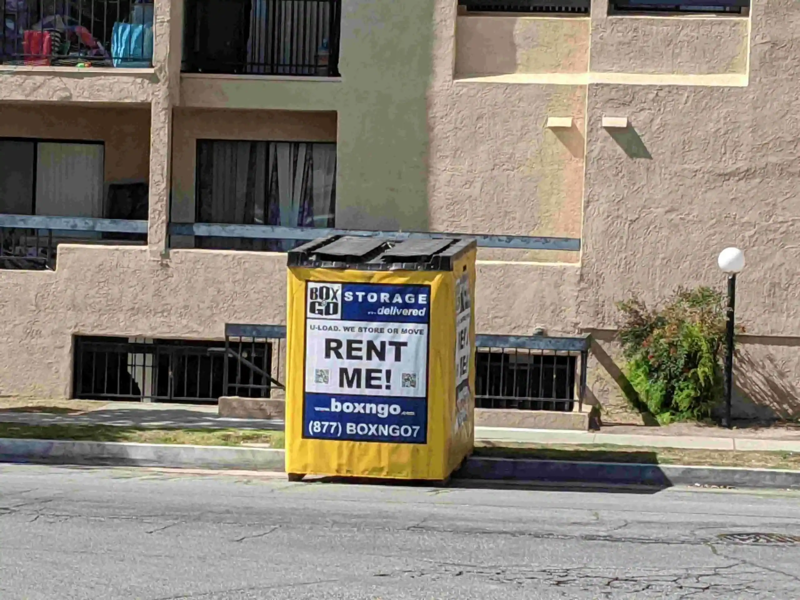 Box-n-Go portable storage container placed outside an apartment building, showing services offered by a local moving company in Sherman Oaks for convenient and flexible relocations.