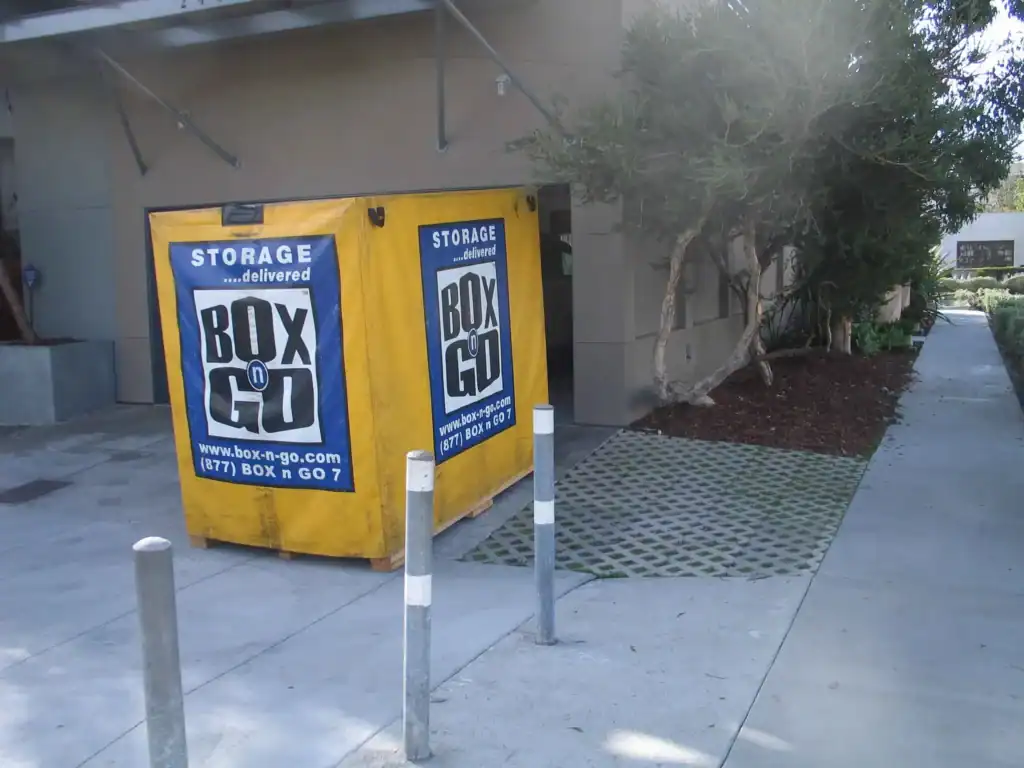 Box-n-Go portable storage container positioned outside a residential building, offering convenient and flexible short term storage in Sherman Oaks for moving or temporary space needs.