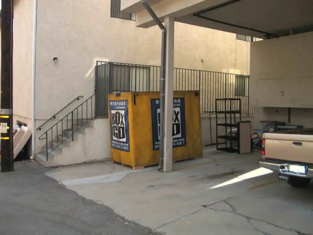Box-n-Go portable storage containers placed in an apartment parking area, offering secure and accessible student storage in Sherman Oaks for college move-outs and seasonal storage needs.