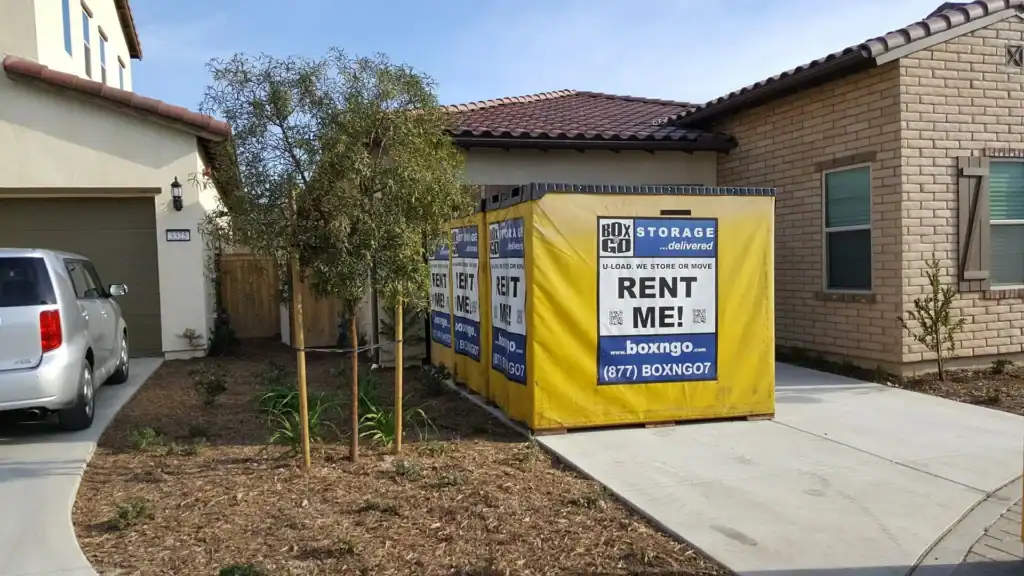Box-n-Go portable storage containers placed in the driveway of a modern Encino home, illustrating convenient and flexible moving solutions provided by a trusted local moving company in Encino.