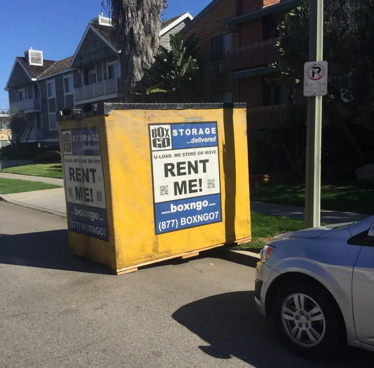 Bright yellow Box-n-Go portable storage container parked on a residential street, promoting convenient and affordable self storage in Arleta CA for moving, remodeling, and long-term storage needs.