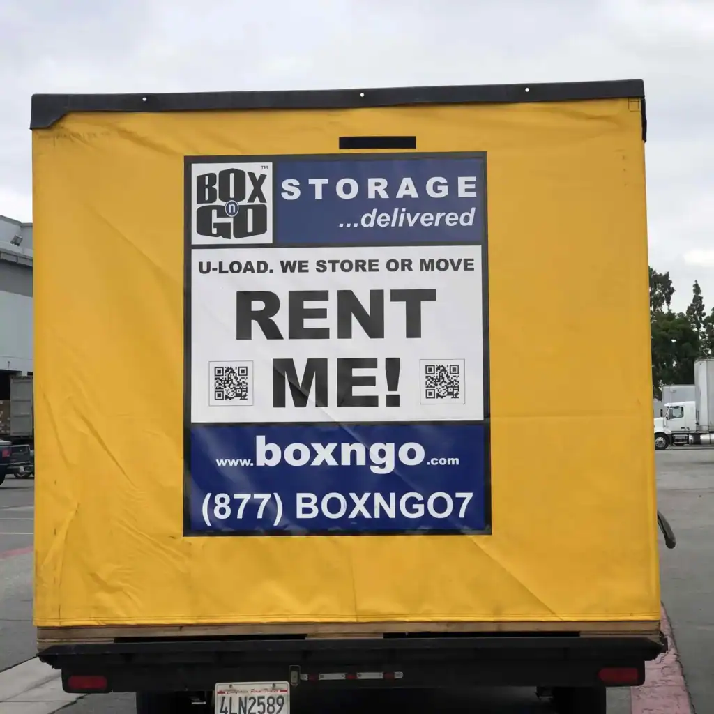 Close-up of a yellow Box-n-Go portable storage container with 'Rent Me' sign, promoting convenient and flexible Self Storage Unit in Calabasas CA for moving and personal storage needs.
