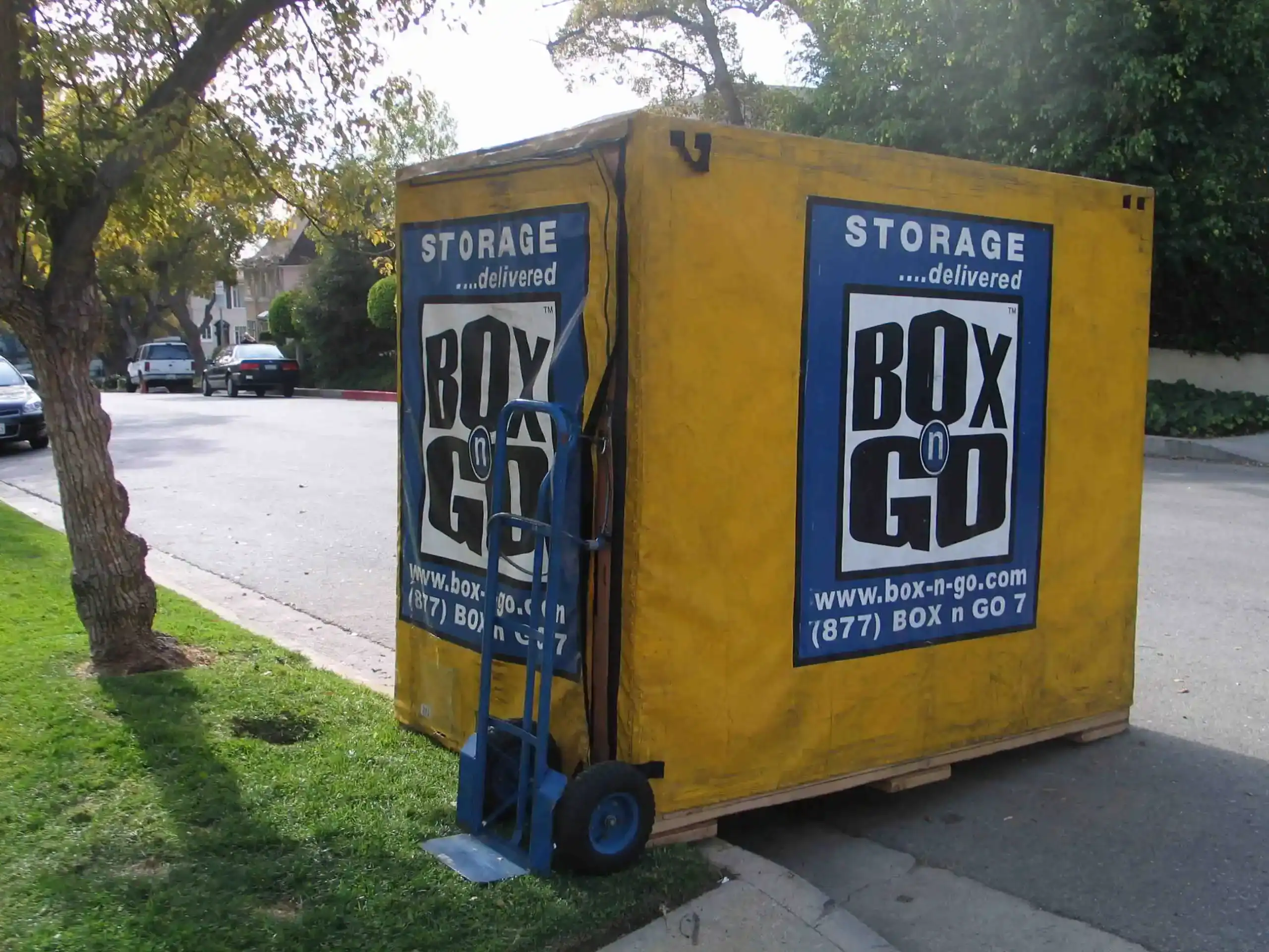 Moving containers in Sherman Oaks provided by Box n Go, shown as a portable yellow storage unit on a residential street, ideal for local or long-distance moves in Sherman Oaks.