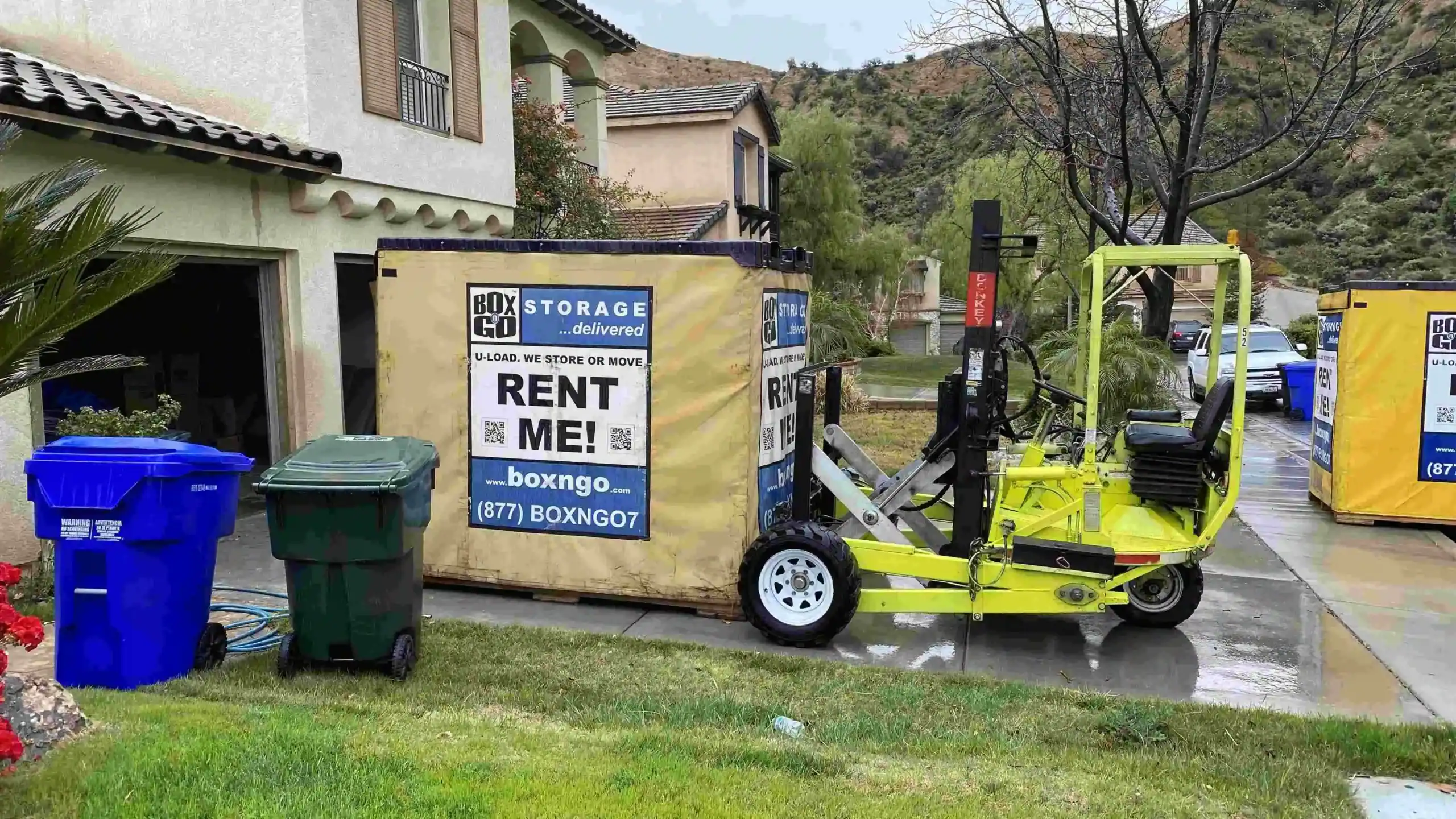 Portable storage container placed in front of a Sherman Oaks home with a forklift and rental signage, showing a Box-n-Go unit requiring a permit for portable storage in Sherman Oaks residential area.