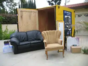 Portable storage container with furniture and boxes being loaded in Sherman Oaks, showcasing decluttering tips. The BoxGo container provides a practical solution for residents looking to organize and downsize their belongings in Sherman Oaks.