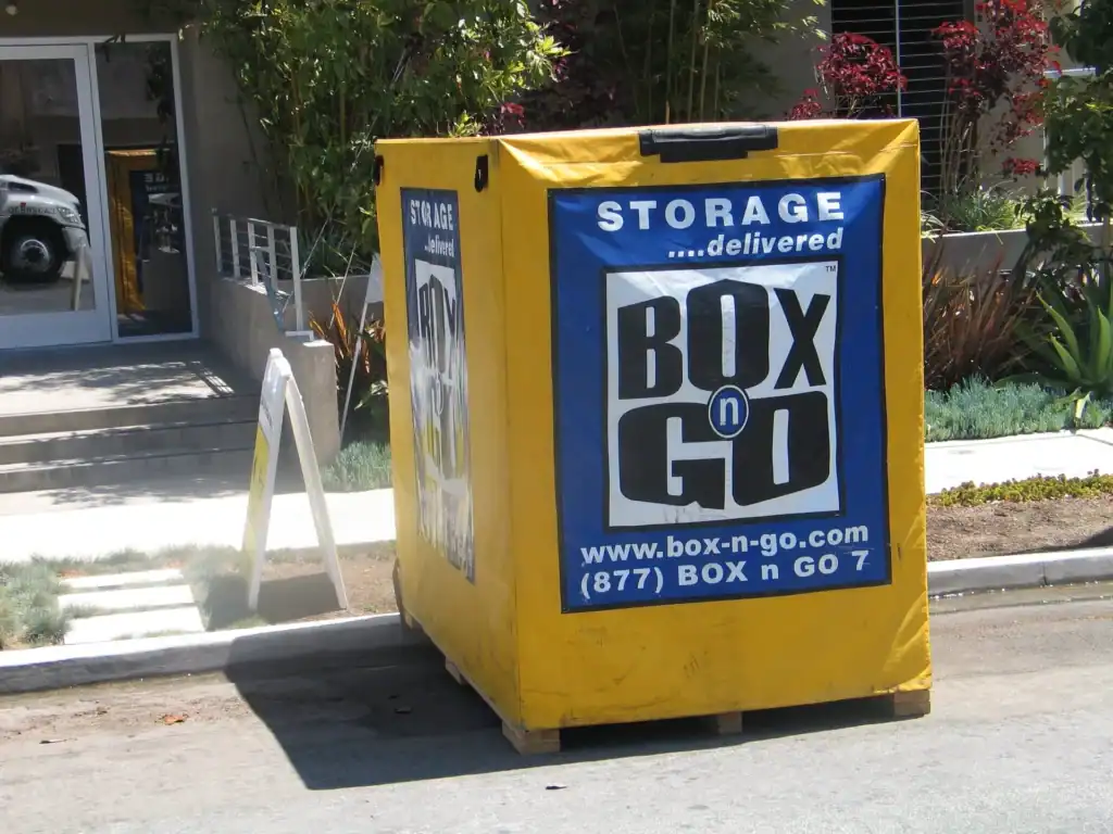 Portable storage units in Santa Monica from Box n Go, offering convenient and flexible storage solutions. The image shows a yellow storage container placed outside a building, showcasing how Box n Go delivers secure, on-demand portable storage units in Santa Monica for moving or storage needs.