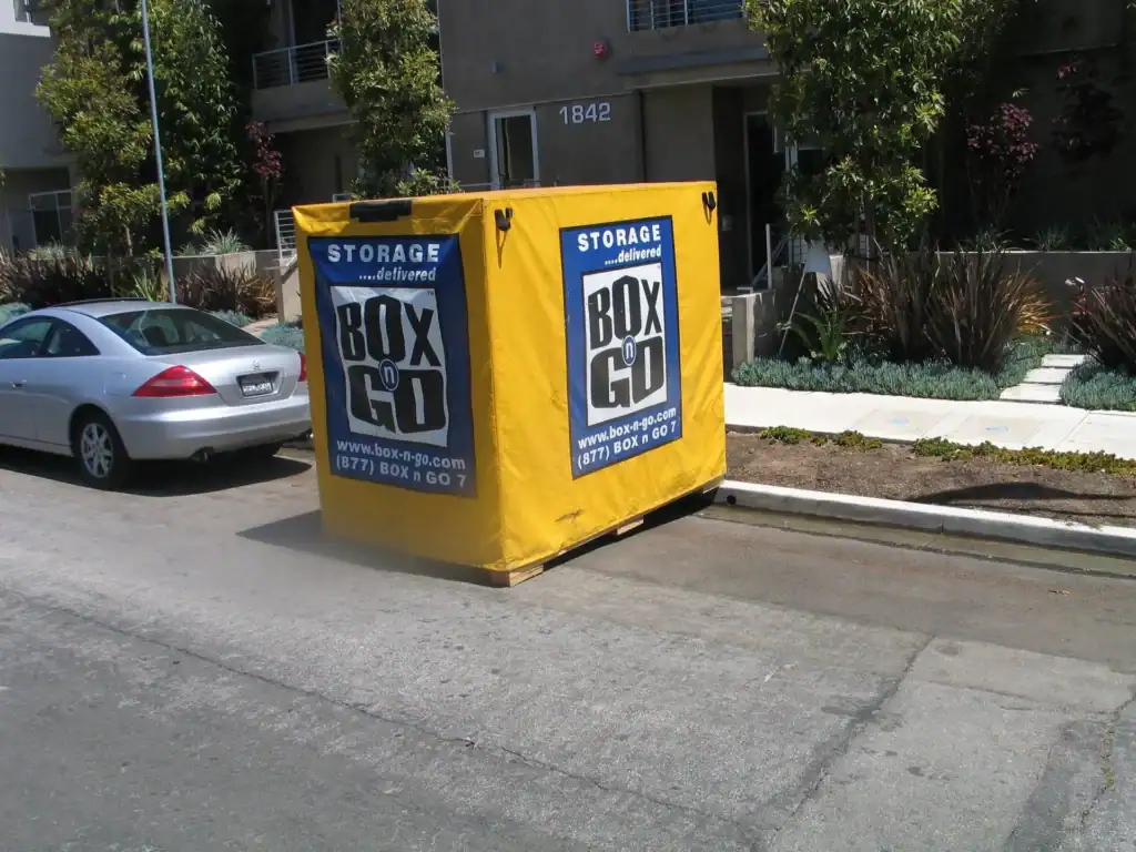 Portable storage units in Santa Monica provided by Box n Go. The image showcases a yellow storage container parked on a residential street, perfect for convenient and flexible storage solutions in Santa Monica. Box n Go offers on-demand portable storage units delivered to your location.