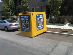 Portable storage units in Santa Monica provided by Box n Go. The image showcases a yellow storage container parked on a residential street, perfect for convenient and flexible storage solutions in Santa Monica. Box n Go offers on-demand portable storage units delivered to your location.