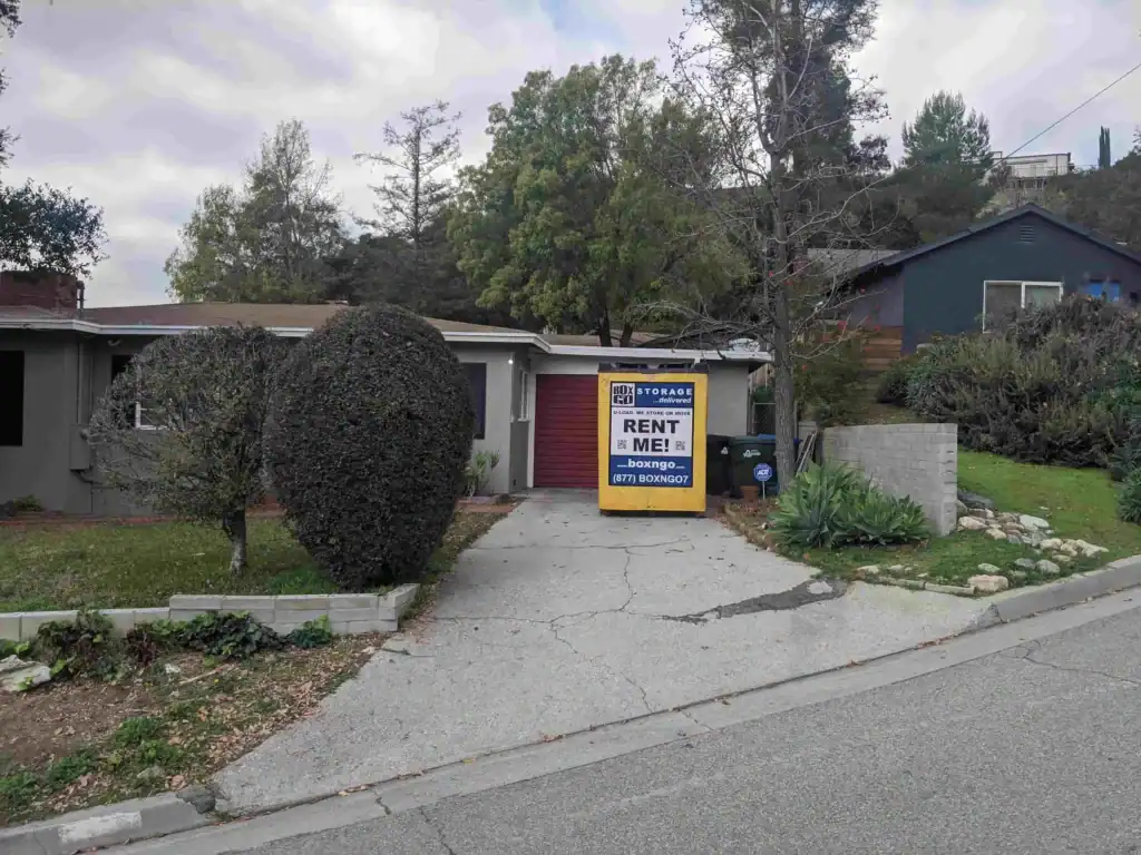 Residential driveway in Sherman Oaks with a Box-n-Go portable storage container, illustrating the need for a permit for portable storage in Sherman Oaks neighborhoods.