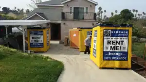 Residential driveway with Box-n-Go portable units for storage container rental Santa Monica, offering convenient and flexible moving and storage solutions.