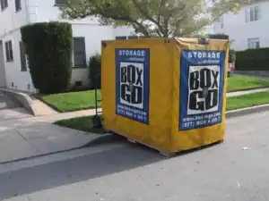 Storage container rental in Sherman Oaks featuring a yellow Box n Go portable storage unit, ideal for convenient, delivered storage solutions. Perfect for moving or decluttering in Sherman Oaks.