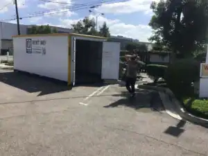 Temporary storage solution in Valley Glen with a portable storage container labeled 'Rent Me!' parked in an outdoor lot, offering a convenient option for people needing extra storage space for personal or renovation items.