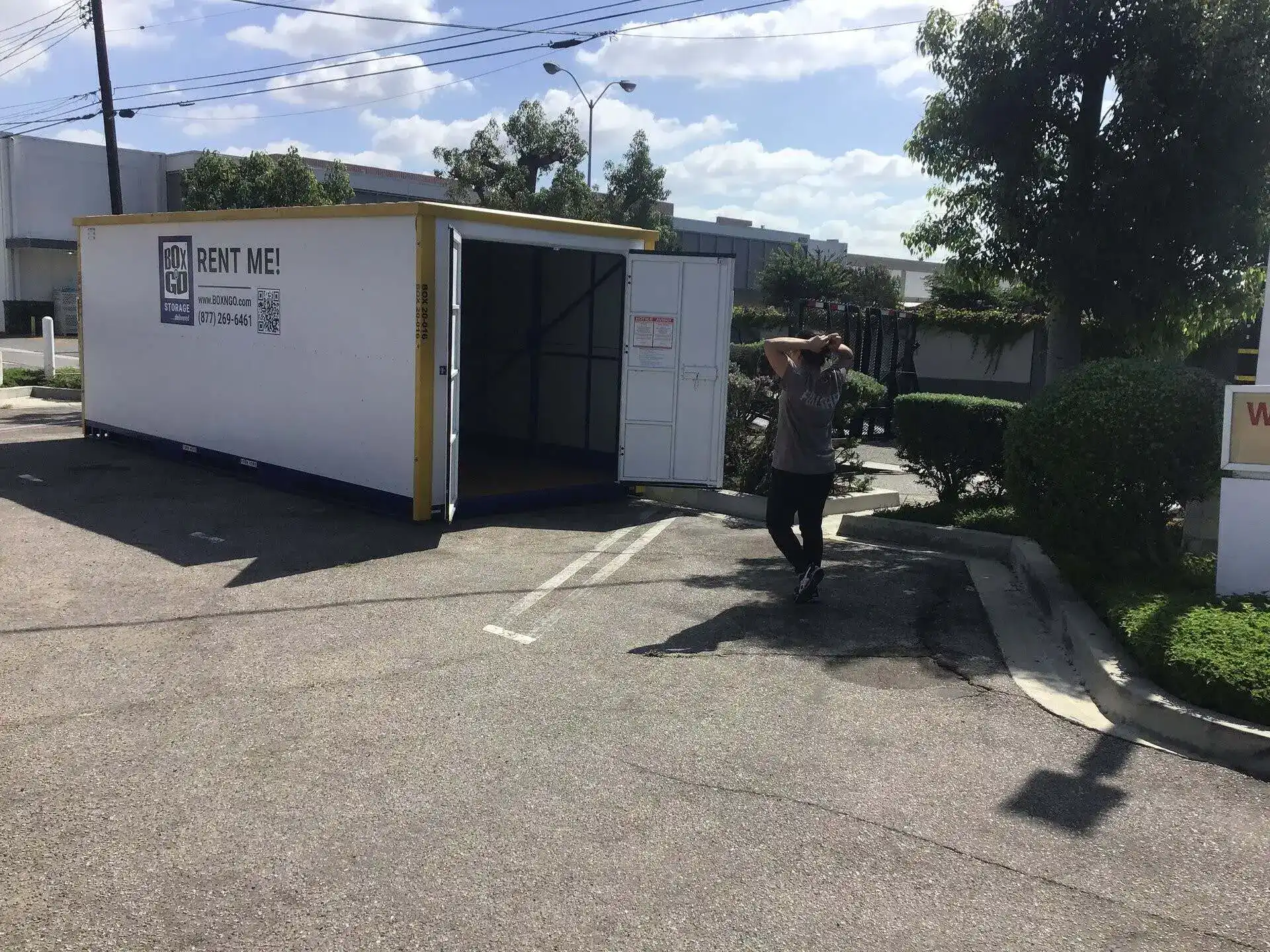 Temporary storage solution in Valley Glen with a portable storage container labeled 'Rent Me!' parked in an outdoor lot, offering a convenient option for people needing extra storage space for personal or renovation items.